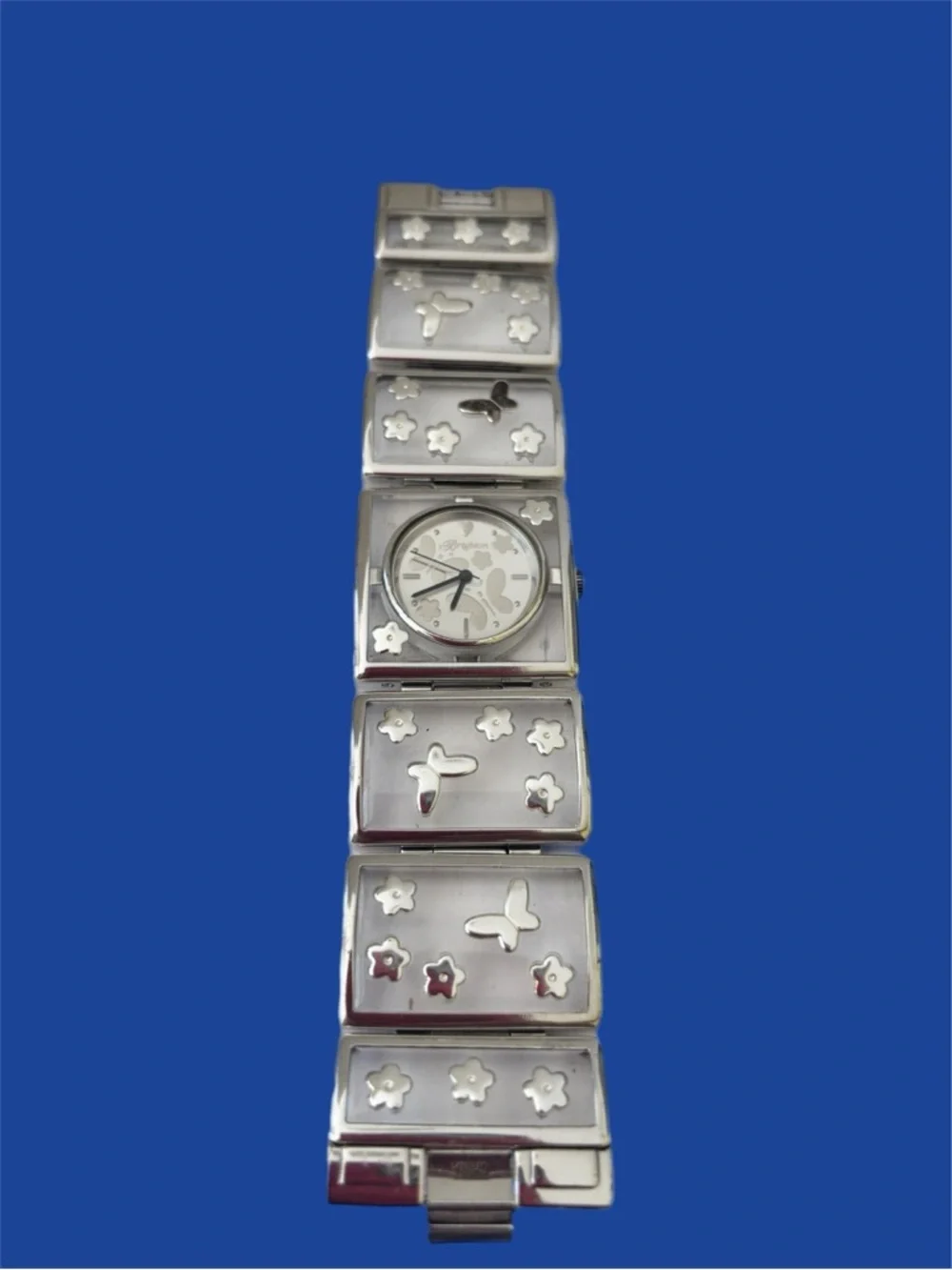 Brighton Gainesville watch features a design silver-tone butterflies & flowers.